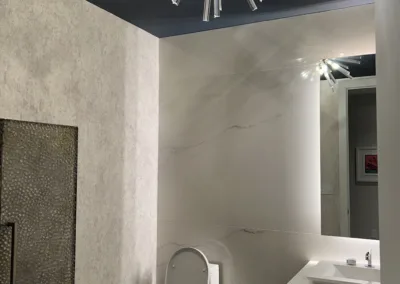 A modern bathroom with a toilet and sink.