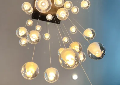 A chandelier with a lot of glass balls hanging from it.